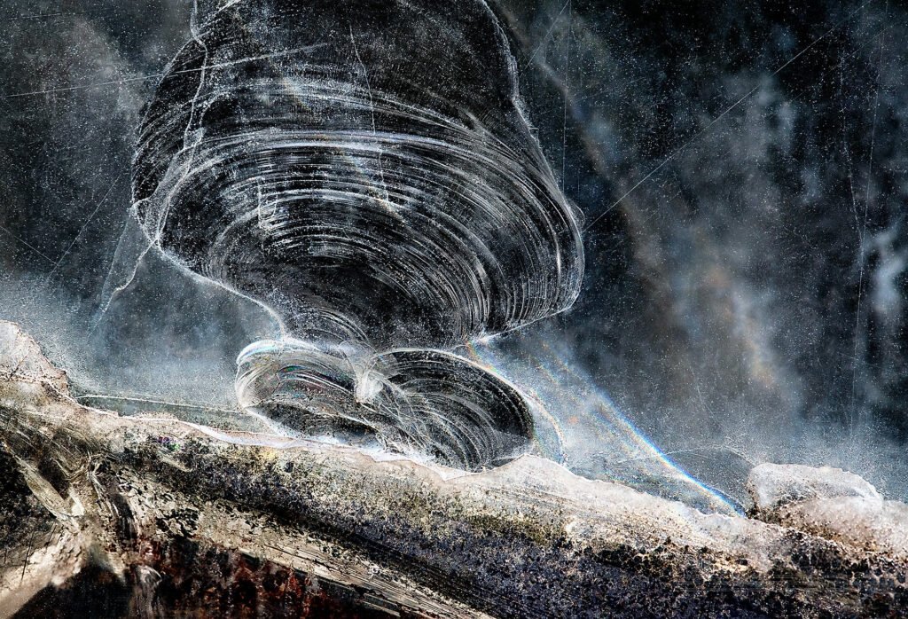 Abstract glass photograph with tension-filled patterns – capturing the suspended moment before emotional and worldly collapse, raw and luminous.